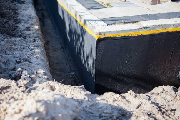 Professional Waterproofing technician working in Ravenna, MI
